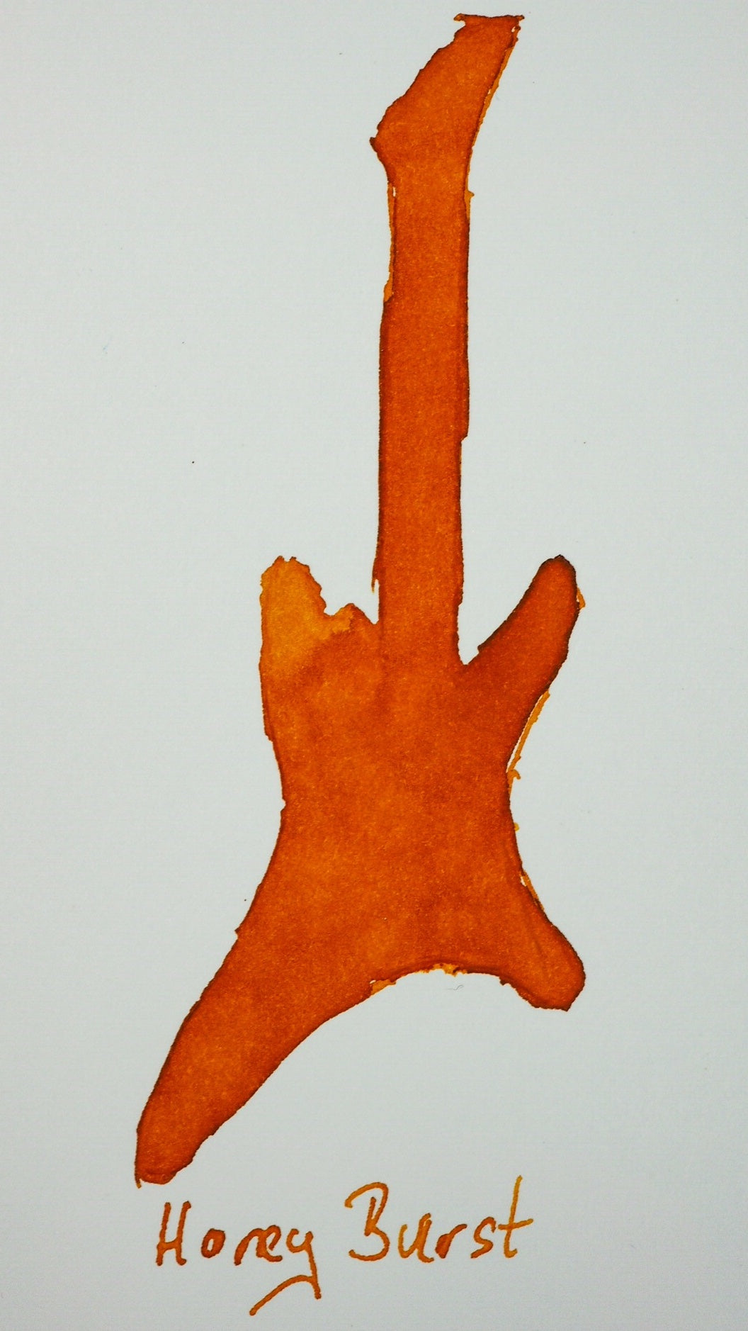 Swatch von Diamine Honey Burst in Form einer Gitarre.