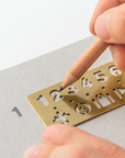 Traveler's Notebook Company - brass bookmark numbers