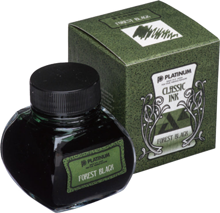 Platinum Tinte Forest Black in einer 60ml Glasflasche neben der dazughörigen Verpackung.